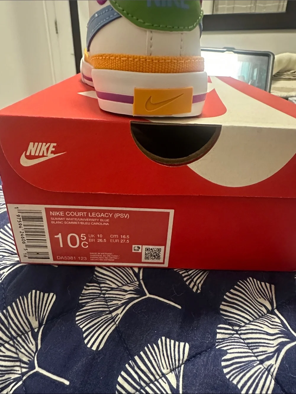 Nike Kids White Sneaker with Blue Swoosh and Purple Lining